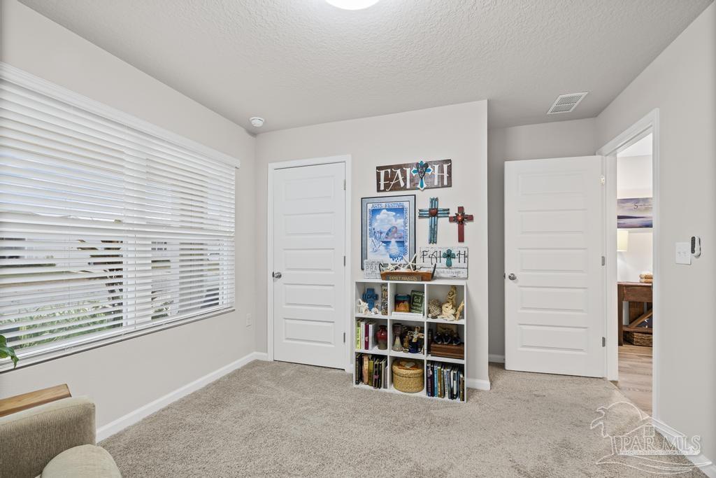 5443 Peach Drive Pace, FL 32571 - Photo 28 of 34 a view of an empty room with shelves