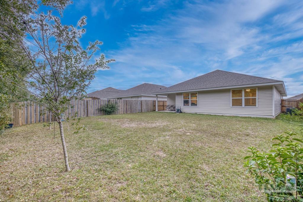 5443 Peach Drive Pace, FL 32571 - Photo 32 of 34 a backyard of a house