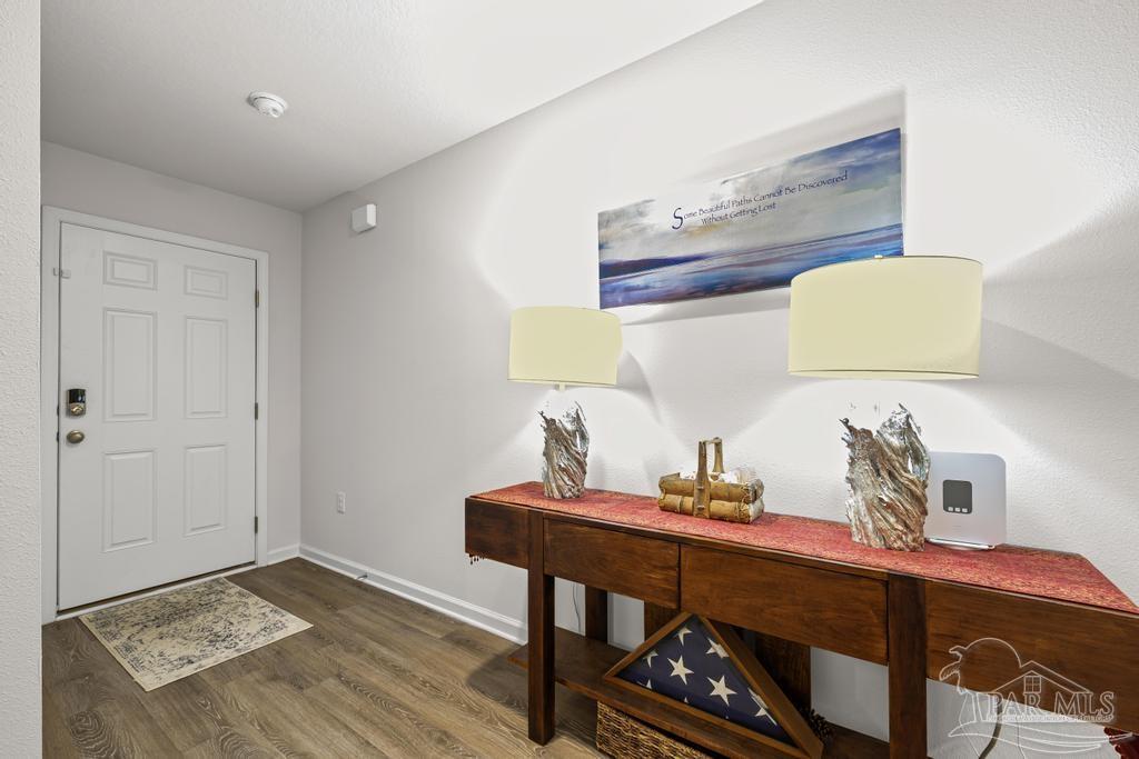 5443 Peach Drive Pace, FL 32571 - Photo 6 of 34 a workspace with furniture and lamp