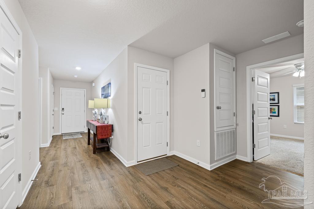 5443 Peach Drive Pace, FL 32571 - Photo 8 of 34 a view of livingroom with furniture and wooden floor