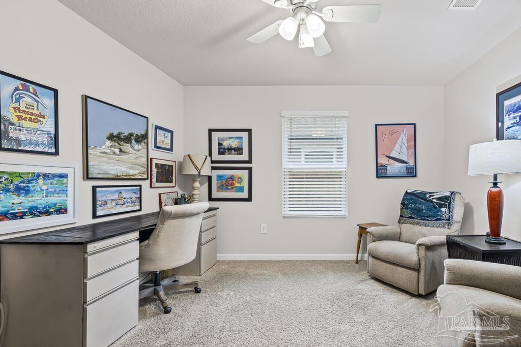 5443 Peach Drive Pace, FL 32571 - Photo 9 of 34 a living room with furniture and a window