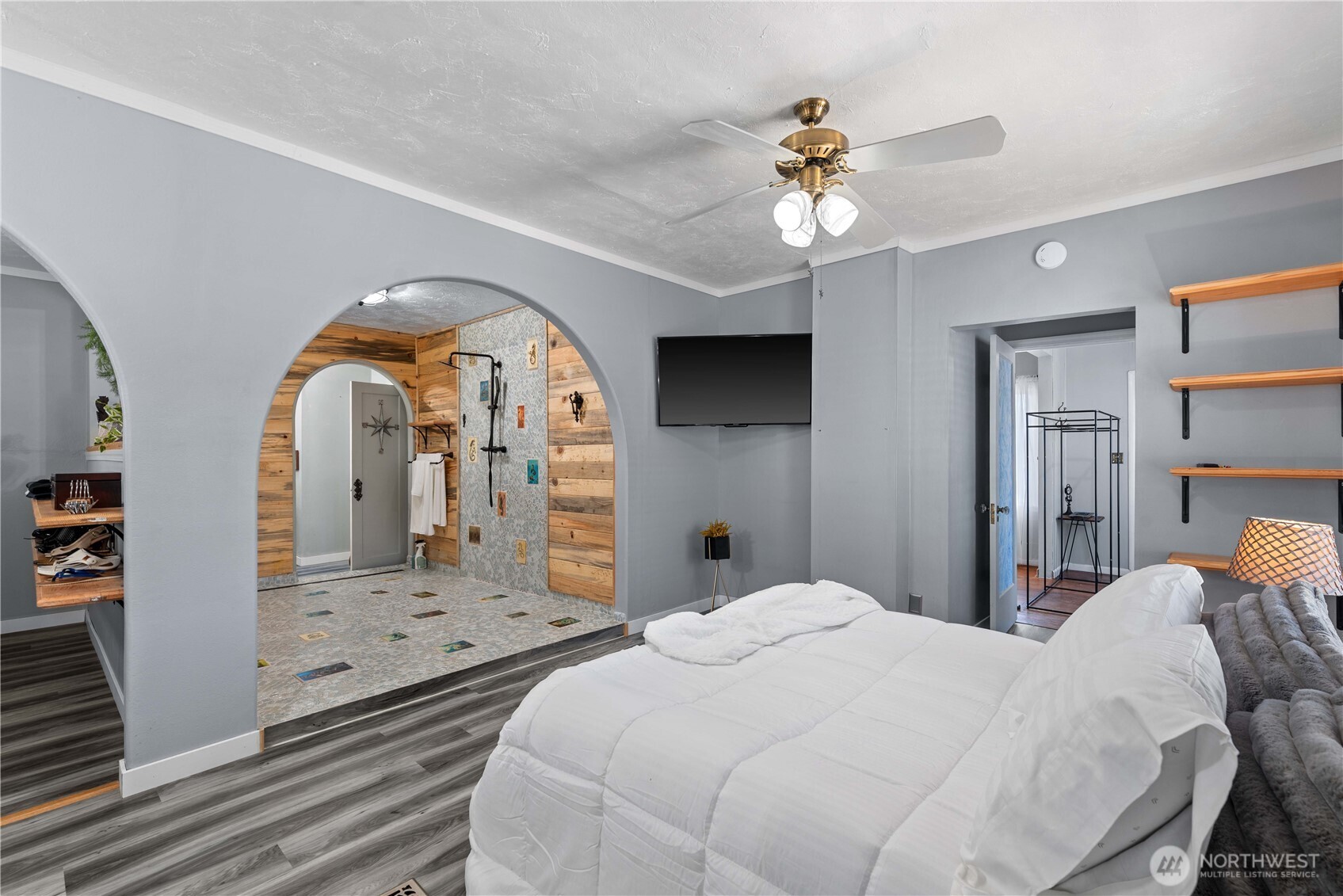 22 South Emerson Avenue Wenatchee, WA 98801 - Photo 11 of 38 a bedroom with a bed and a chandelier