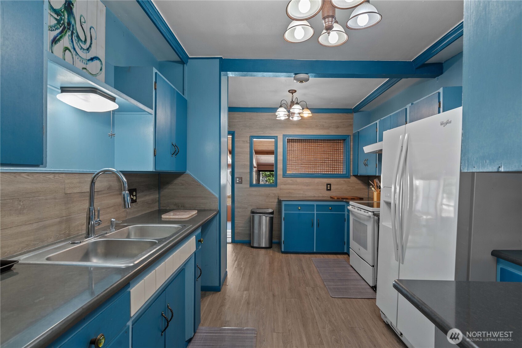 22 South Emerson Avenue Wenatchee, WA 98801 - Photo 20 of 38 a kitchen with a refrigerator and a sink