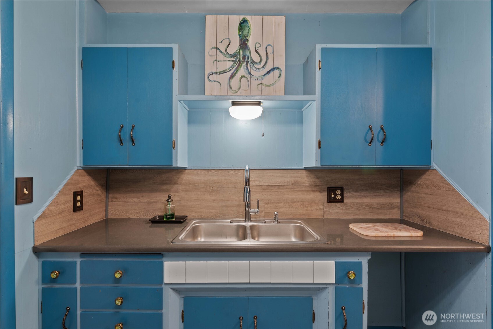 22 South Emerson Avenue Wenatchee, WA 98801 - Photo 21 of 38 a sink with a stove and cabinets