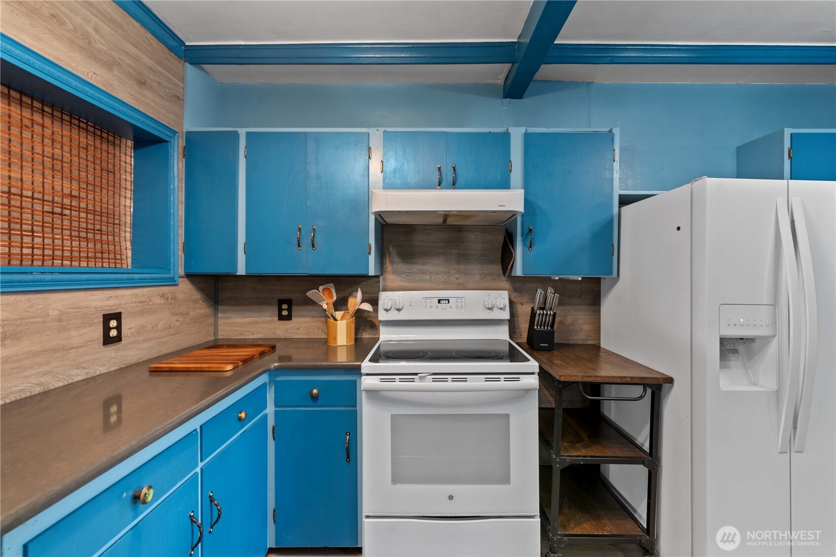 22 South Emerson Avenue Wenatchee, WA 98801 - Photo 22 of 38 a kitchen with a refrigerator sink and cabinets
