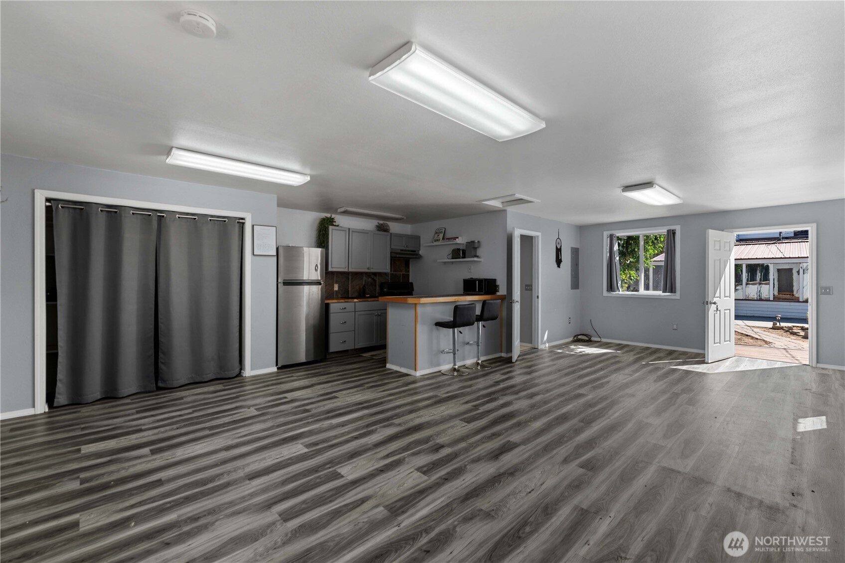 22 South Emerson Avenue Wenatchee, WA 98801 - Photo 34 of 38 a kitchen with stainless steel appliances kitchen island wooden cabinets and entryway
