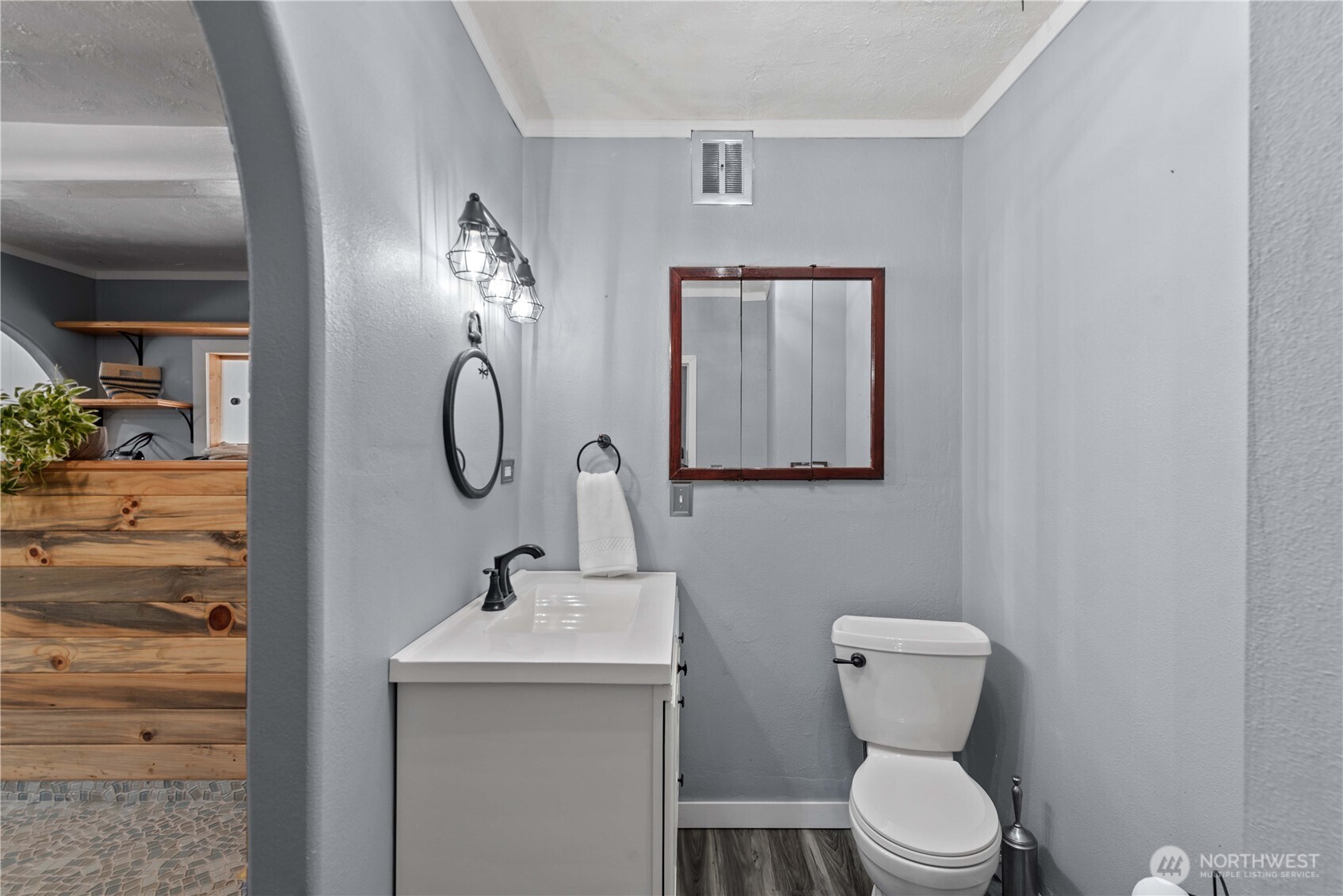 22 South Emerson Avenue Wenatchee, WA 98801 - Photo 8 of 38 a bathroom with a toilet a sink and mirror