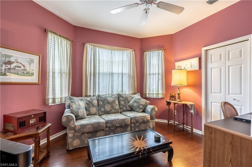 431 Crossfield Circle, Unit 77 Naples, FL 34104 - Photo 19 of 33 a living room with furniture and a window