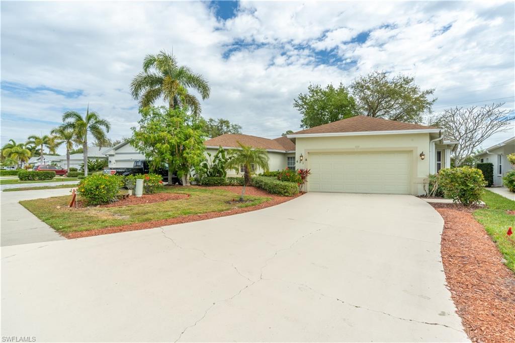 431 Crossfield Circle, Unit 77 Naples, FL 34104 - Photo 2 of 33 a view of a big room with potted plants