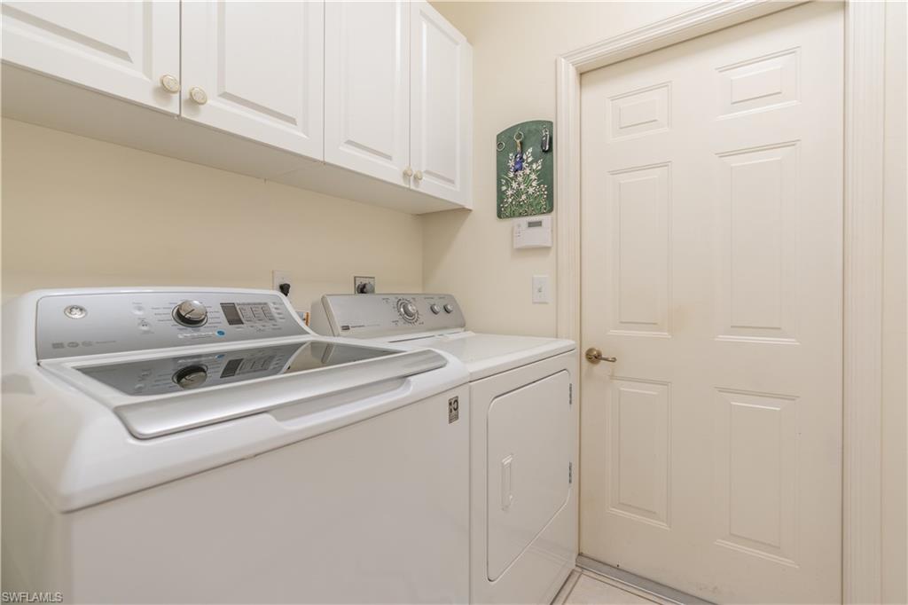 431 Crossfield Circle, Unit 77 Naples, FL 34104 - Photo 26 of 33 a utility room with dryer and washer