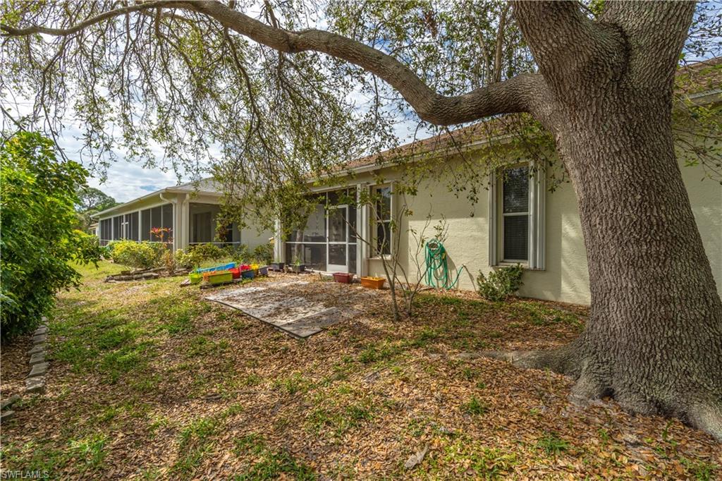 431 Crossfield Circle, Unit 77 Naples, FL 34104 - Photo 31 of 33 a view of a house with a yard