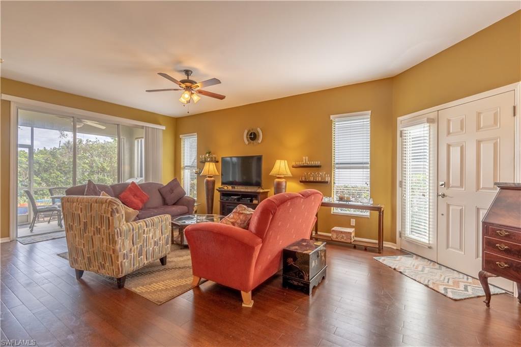 431 Crossfield Circle, Unit 77 Naples, FL 34104 - Photo 4 of 33 a living room with furniture and a large window