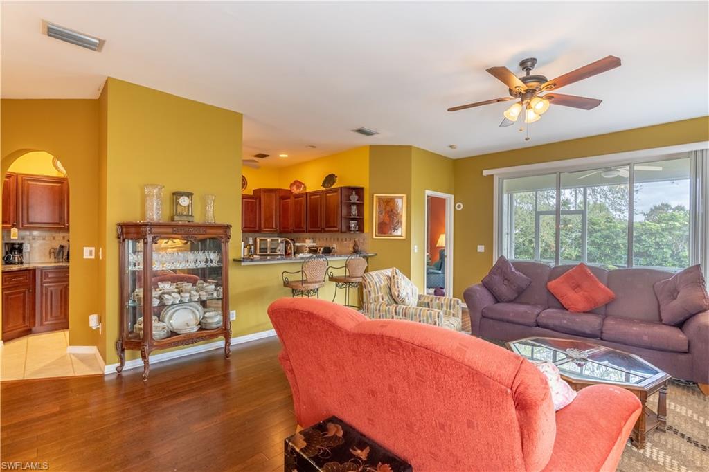 431 Crossfield Circle, Unit 77 Naples, FL 34104 - Photo 5 of 33 a living room with furniture and a large window