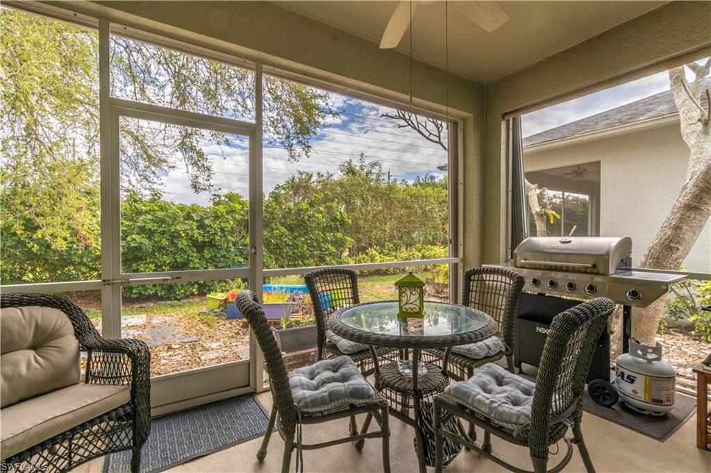 431 Crossfield Circle, Unit 77 Naples, FL 34104 - Photo 7 of 33 a view of a dining room with furniture window and outside view