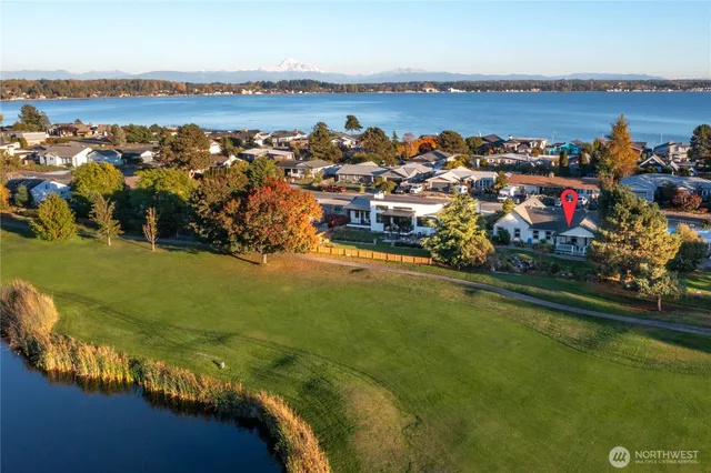 an aerial view of a house with a ocean view