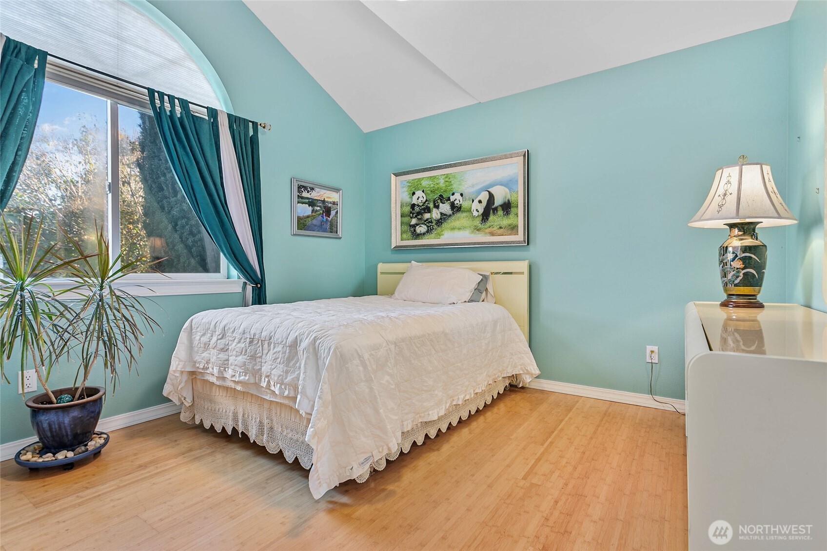 8137 Cowichan Road Blaine, WA 98230 - Photo 15 of 40 a bedroom with a bed and a painting on the wall
