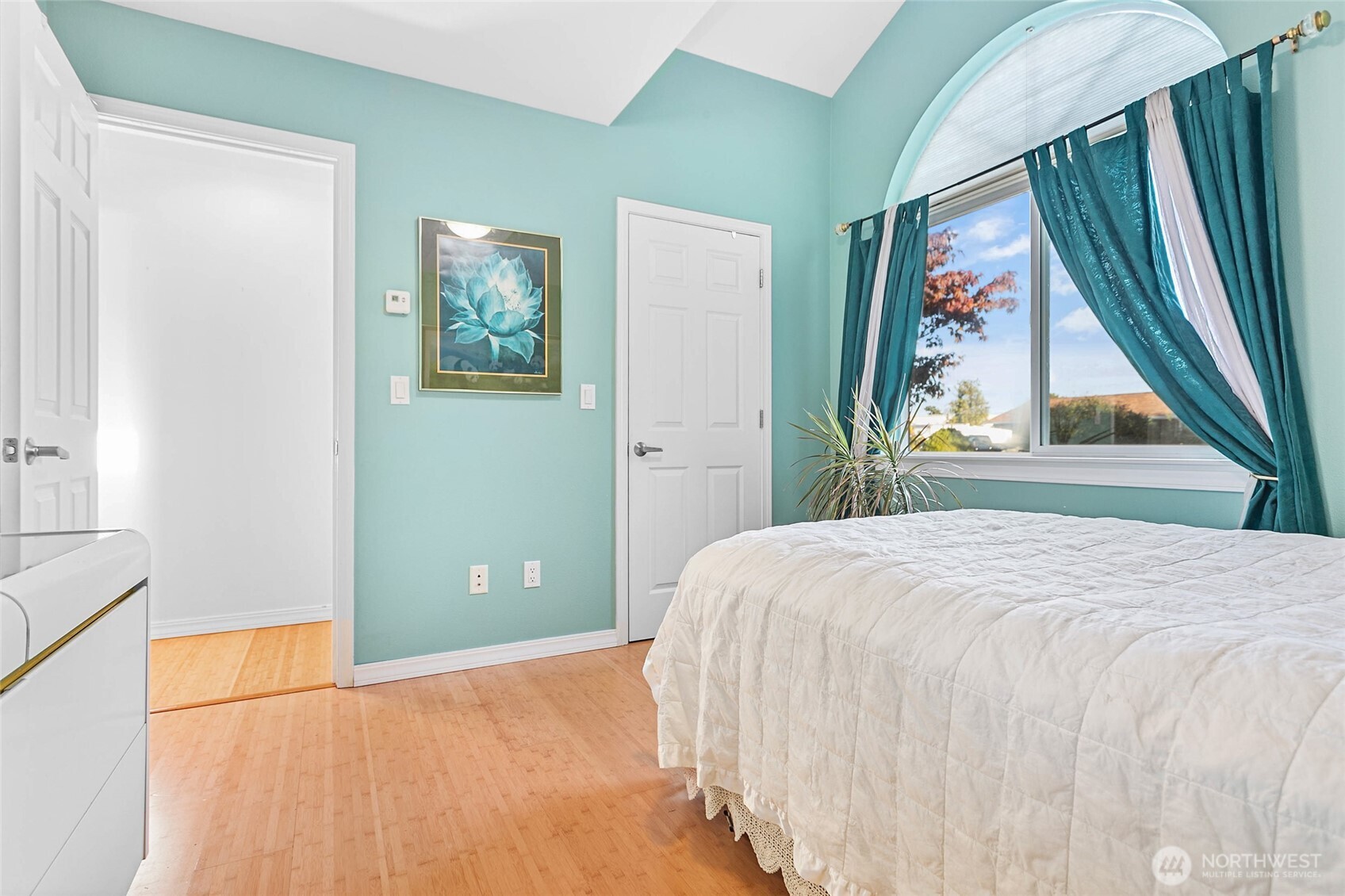 8137 Cowichan Road Blaine, WA 98230 - Photo 16 of 40 a bedroom with a large bed and a window