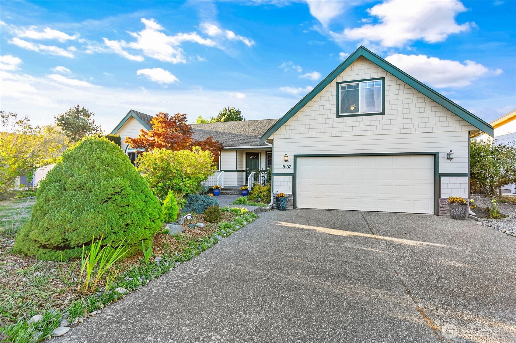 8137 Cowichan Road Blaine, WA 98230 - Photo 2 of 40 a front view of a house with a yard and garage