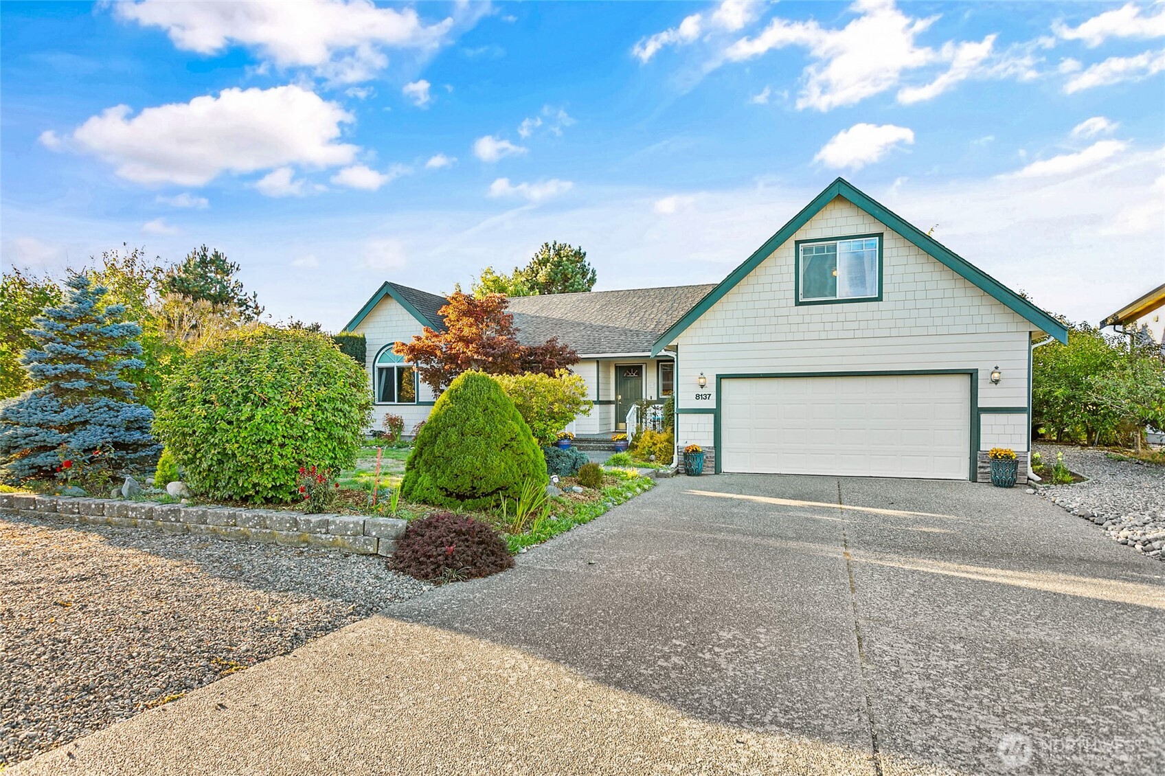 8137 Cowichan Road Blaine, WA 98230 - Photo 40 of 40 a front view of a house with a yard and garage