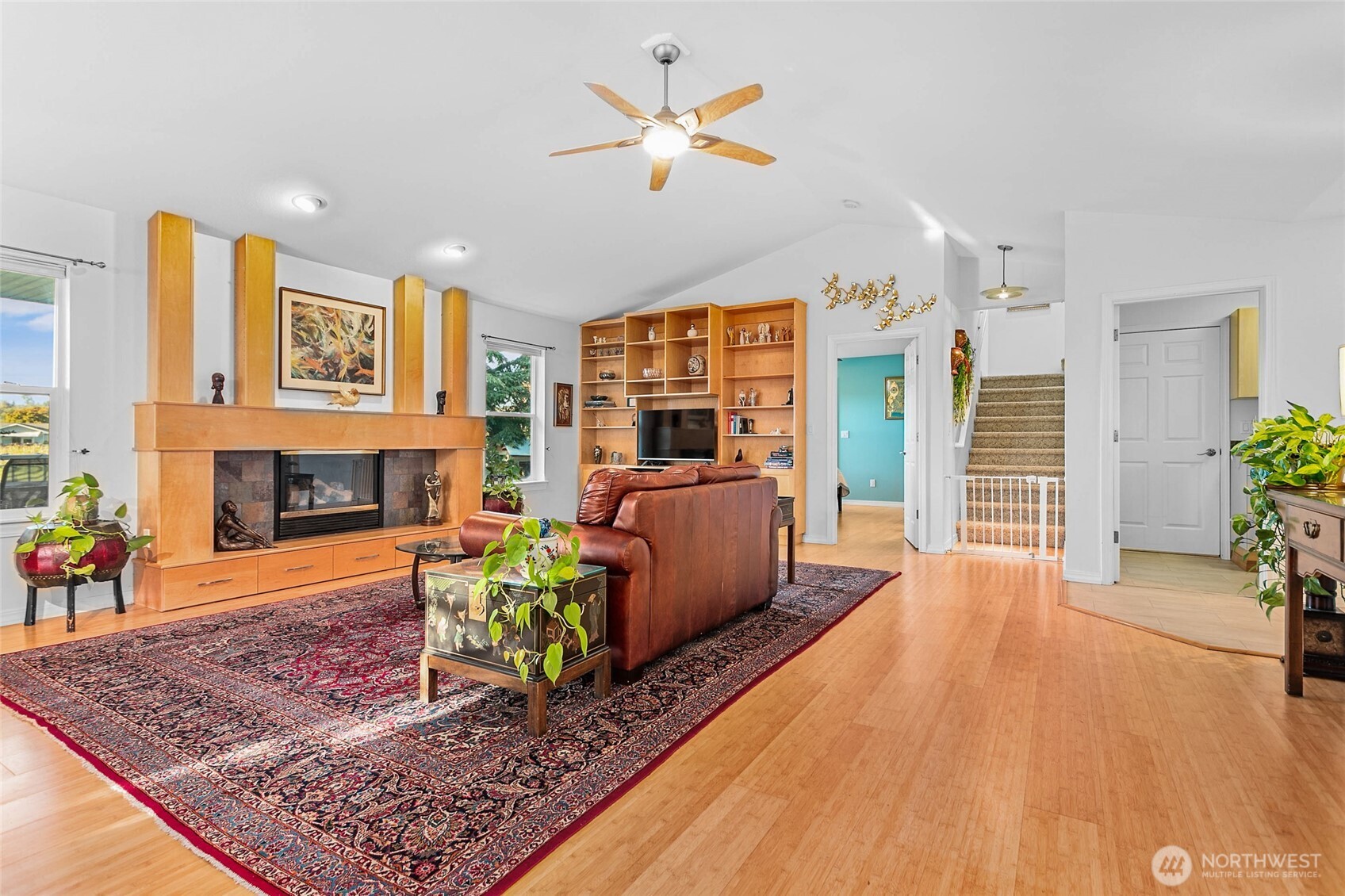 8137 Cowichan Road Blaine, WA 98230 - Photo 7 of 40 a living room with furniture large window and a fireplace