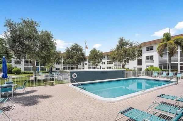 a view of a swimming pool and a yard