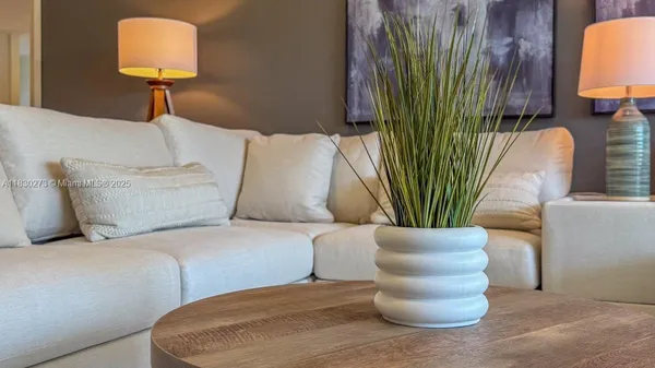 a view of balcony with wooden floor and outdoor seating