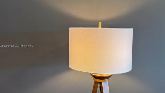 a room with a sink and white cabinets