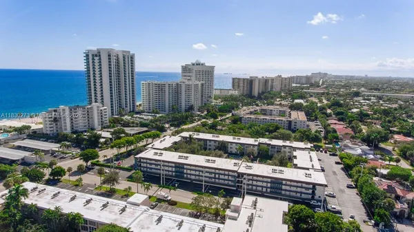 a kitchen with stainless steel appliances granite countertop a refrigerator stove and sink