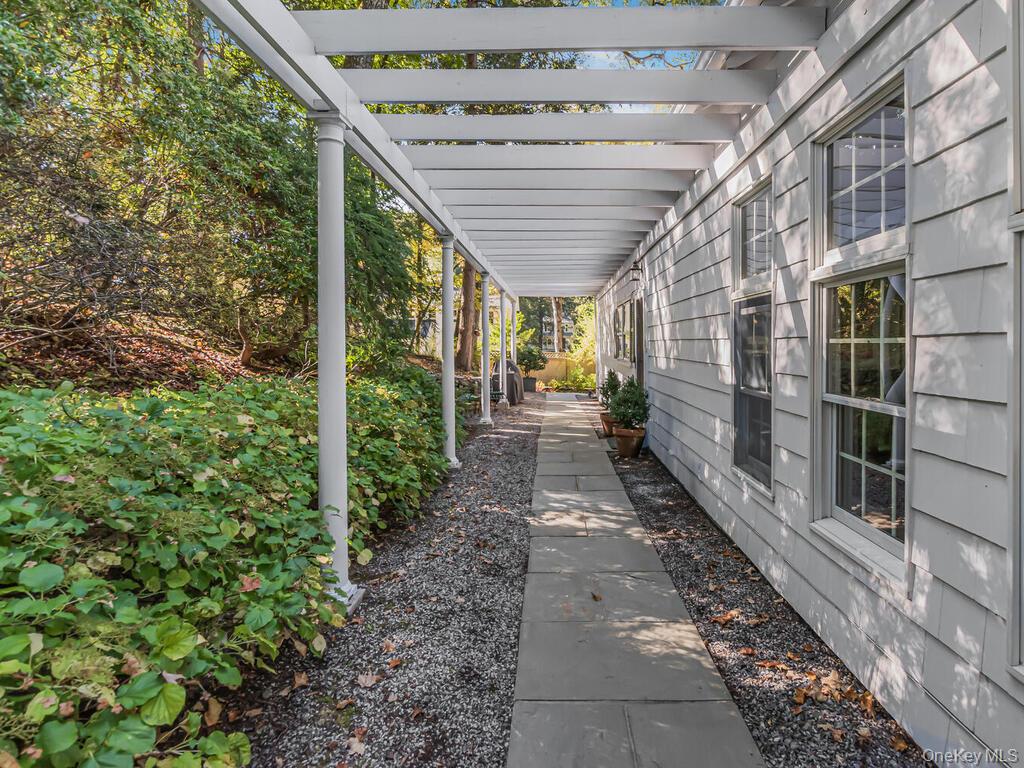 105 Douglas Road Chappaqua, NY 10514 - Photo 14 of 33 View of patio walkway featuring a pergola