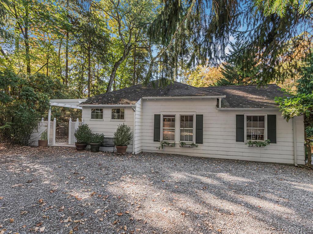 105 Douglas Road Chappaqua, NY 10514 - Photo 25 of 33 Rear view of property with a shingled roof