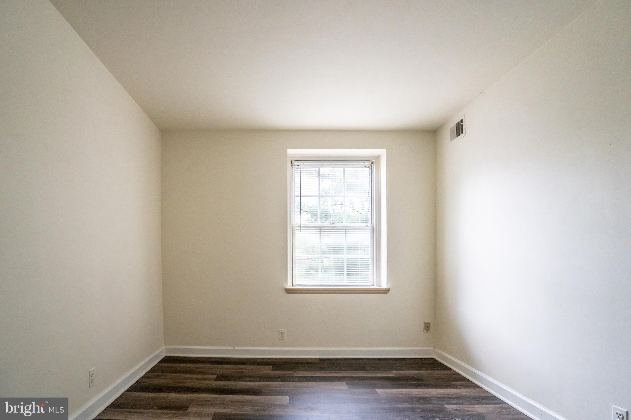 4814 30th Street South, Unit B1 Arlington, VA 22206 - Photo 12 of 18 an empty room with wooden floor and window