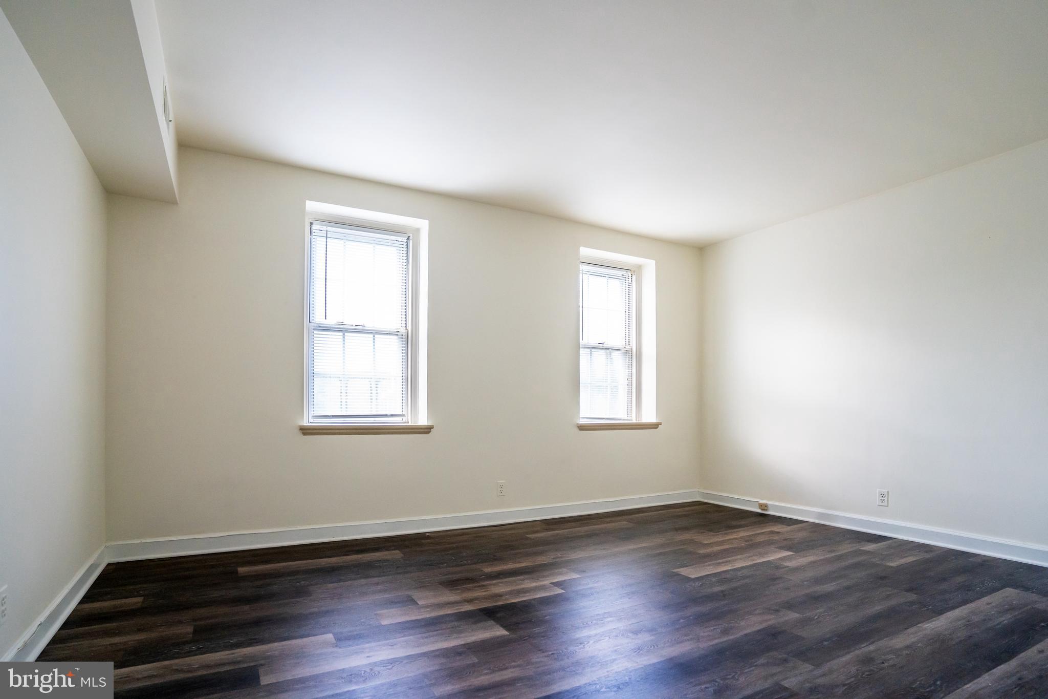 4814 30th Street South, Unit B1 Arlington, VA 22206 - Photo 5 of 18 an empty room with wooden floor and window