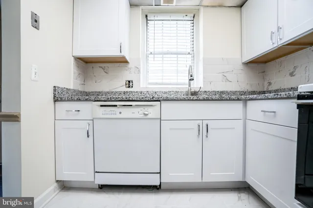 a view of kitchen with a refrigerator a sink and a refrigerator