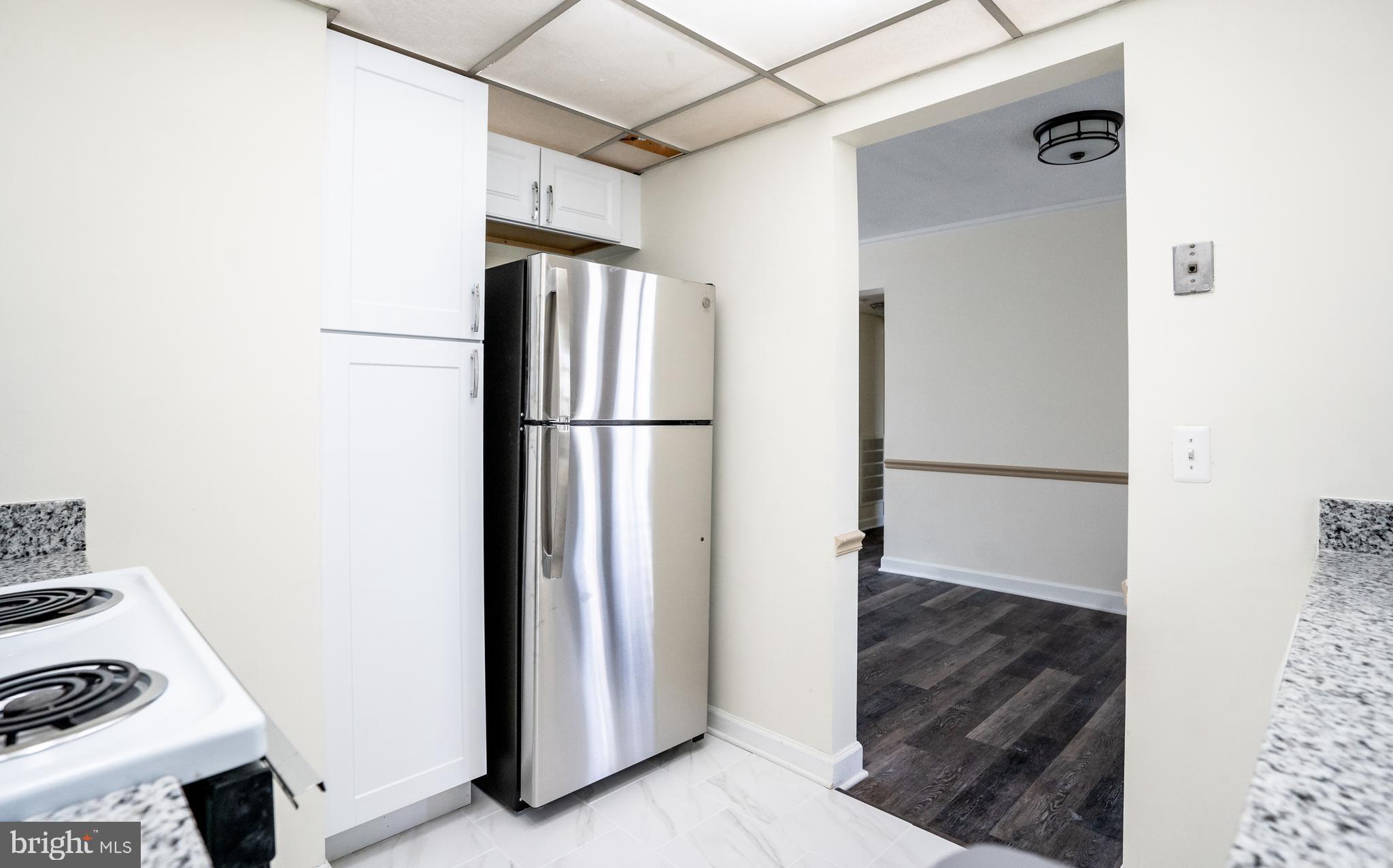 4814 30th Street South, Unit B1 Arlington, VA 22206 - Photo 9 of 18 a view of kitchen with a refrigerator a sink and a refrigerator