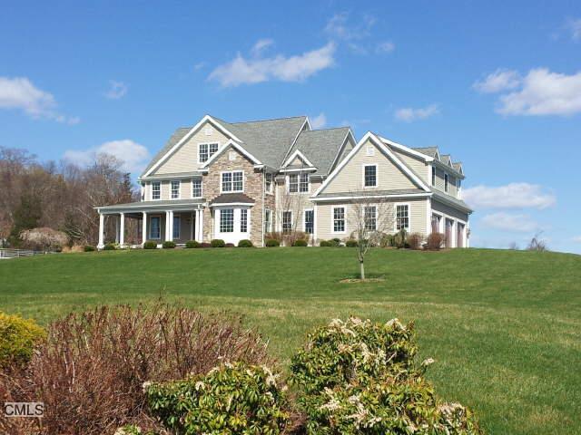 33 Hundred Acres Road Newtown, CT 06470 - Photo 1 of 1 a front view of a house with a garden
