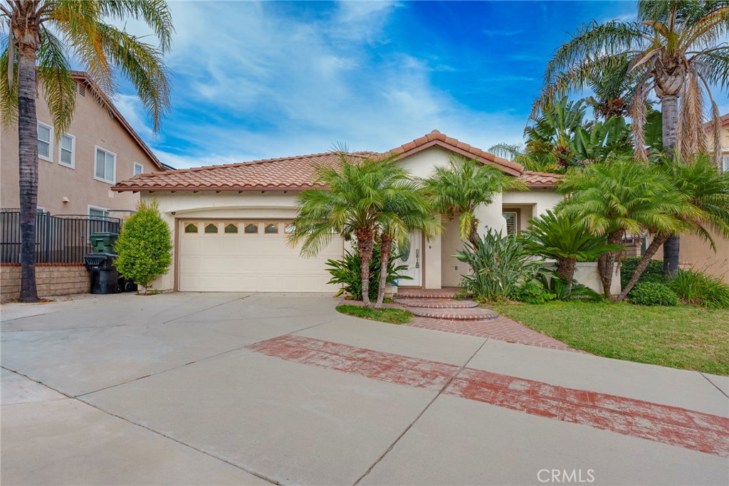 12166 Wembley Court Rancho Cucamonga, CA 91739 - Photo 1 of 1 a house with palm tree in front of it