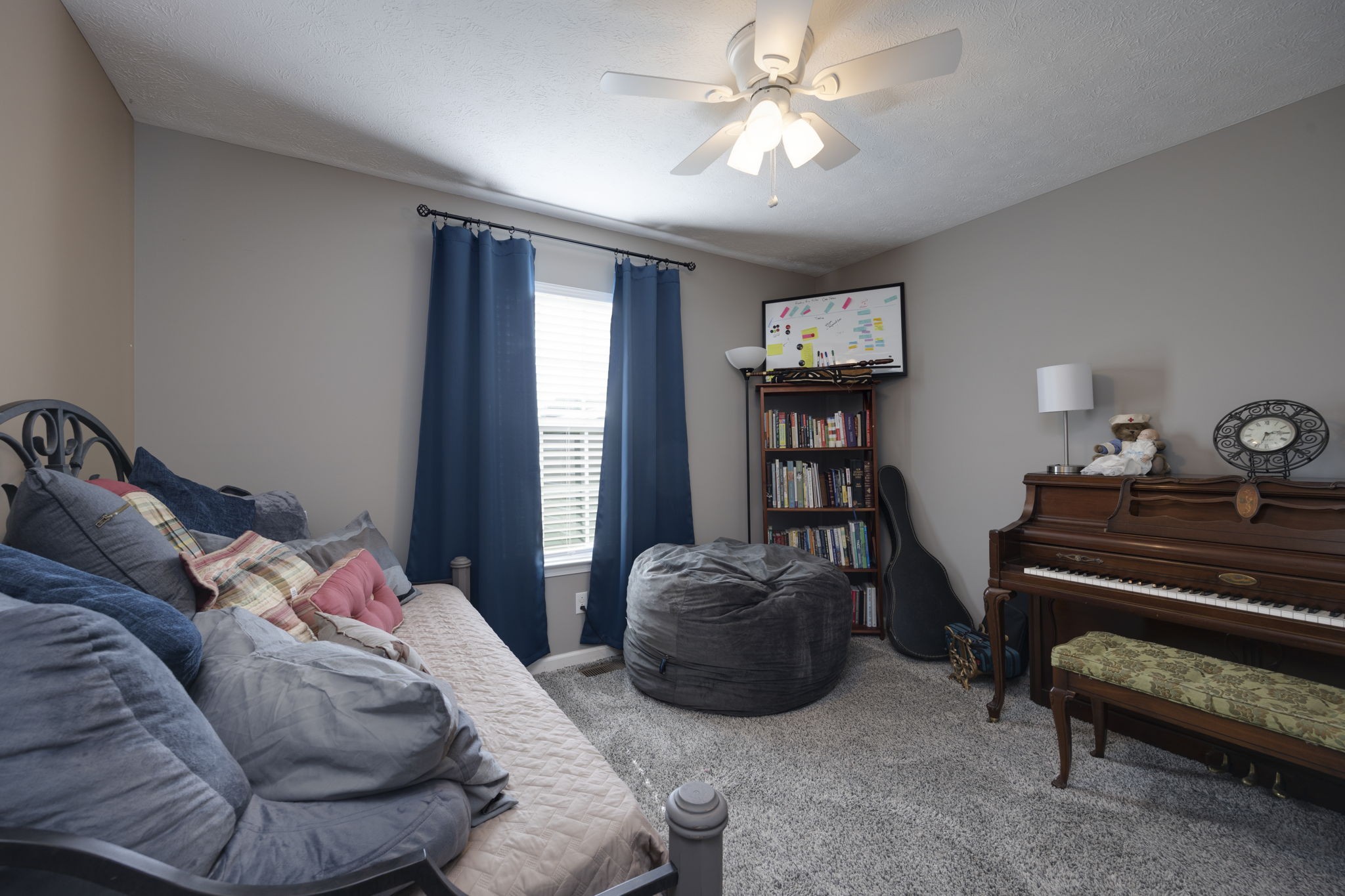 232 Shaub Road Portland, TN 37148 - Photo 25 of 31 a bedroom with a bed and a chandelier