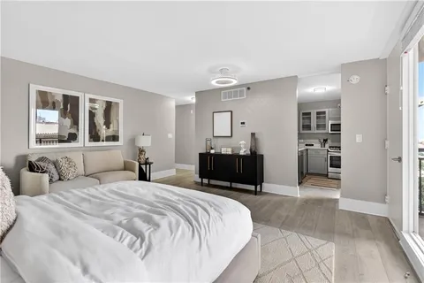 a bedroom with a bed and a view of bathroom