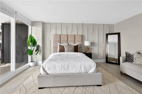 a large white bed in a white room