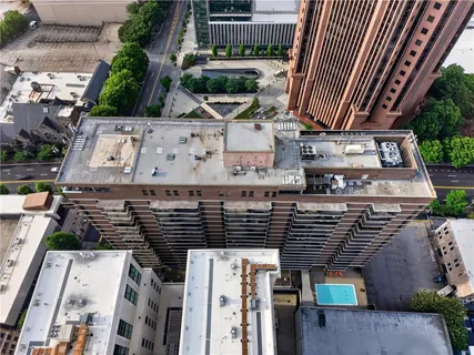 an aerial view of a house with balcony and garage