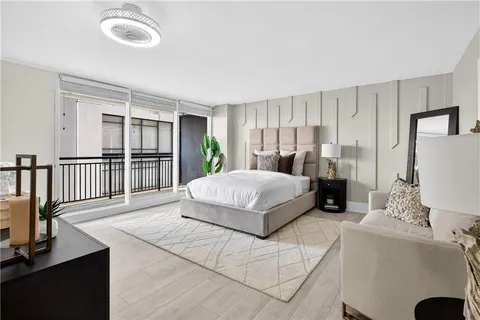 a bedroom with a large bed and a table
