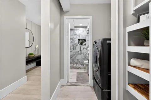 a view of a bathroom from a hallway