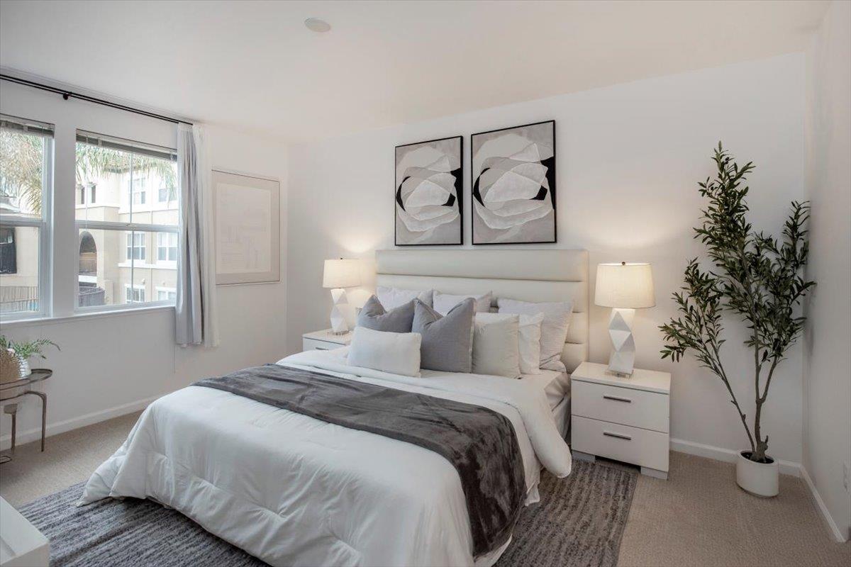 1883 Agnew Road, Unit 341 Santa Clara, CA 95054 - Photo 15 of 38 a bedroom with a bed a couch and a large window