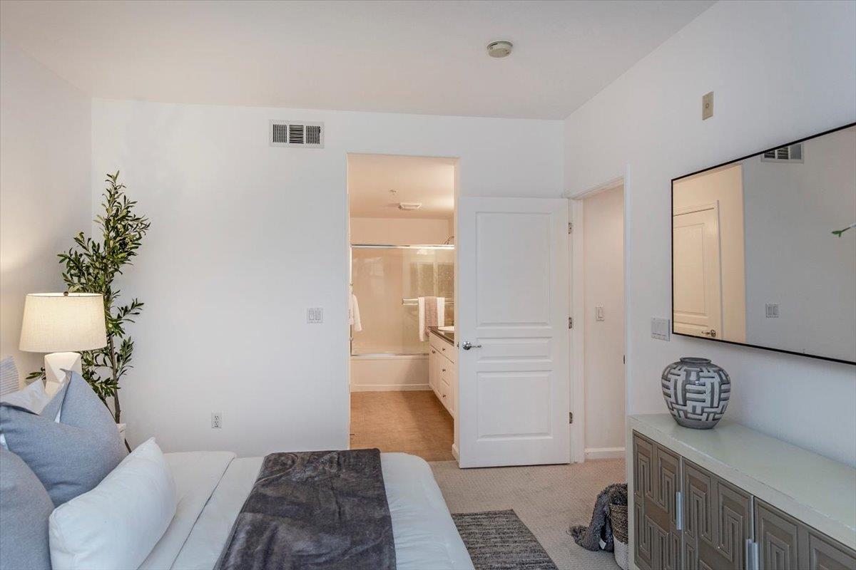 1883 Agnew Road, Unit 341 Santa Clara, CA 95054 - Photo 16 of 38 a bedroom with a bed and a rug
