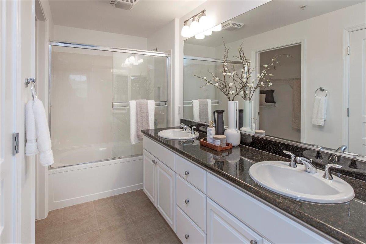 1883 Agnew Road, Unit 341 Santa Clara, CA 95054 - Photo 17 of 38 a bathroom with a double vanity sink mirror and shower