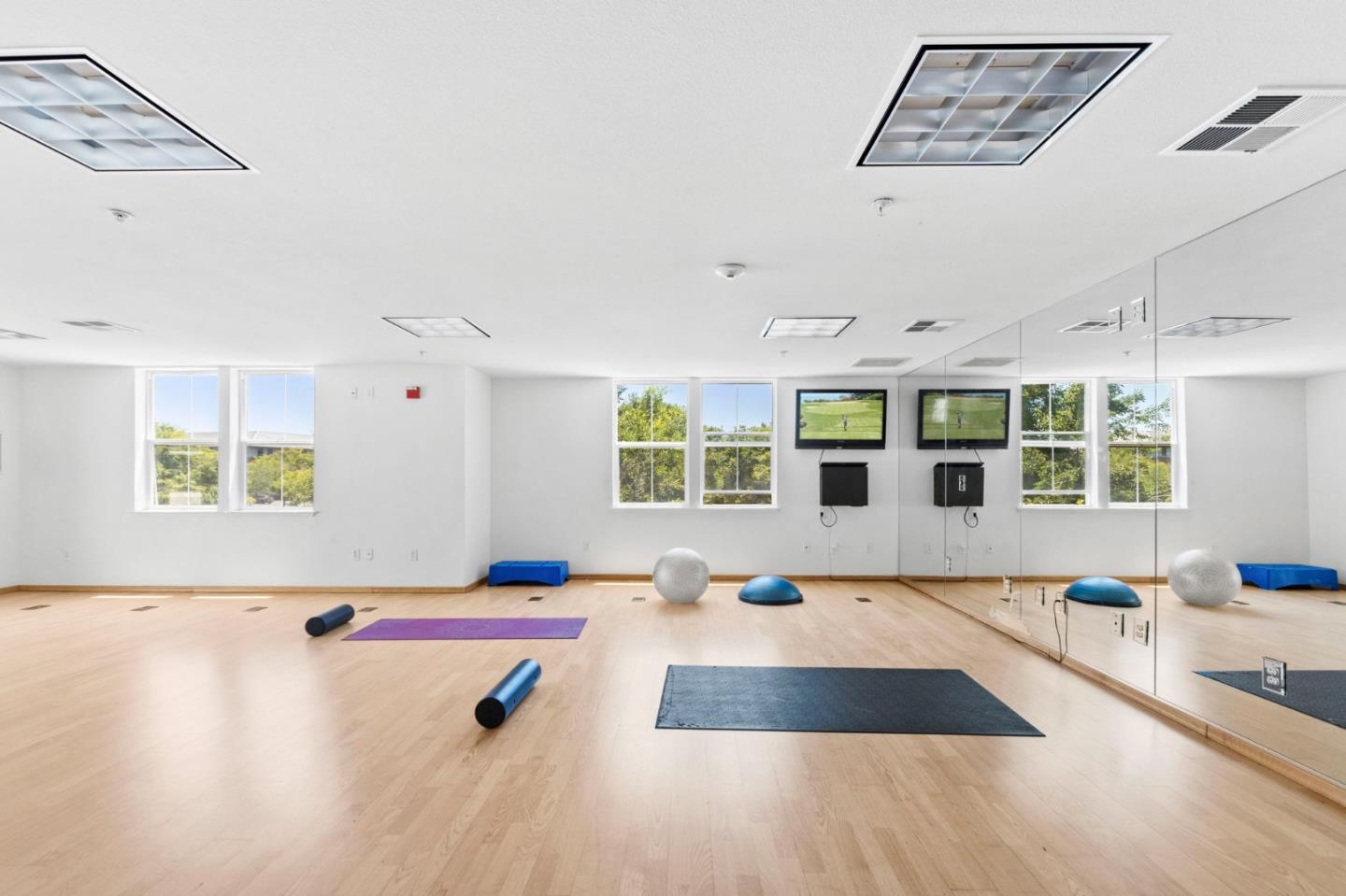 1883 Agnew Road, Unit 341 Santa Clara, CA 95054 - Photo 27 of 38 a living room with patio furniture and floor to ceiling window