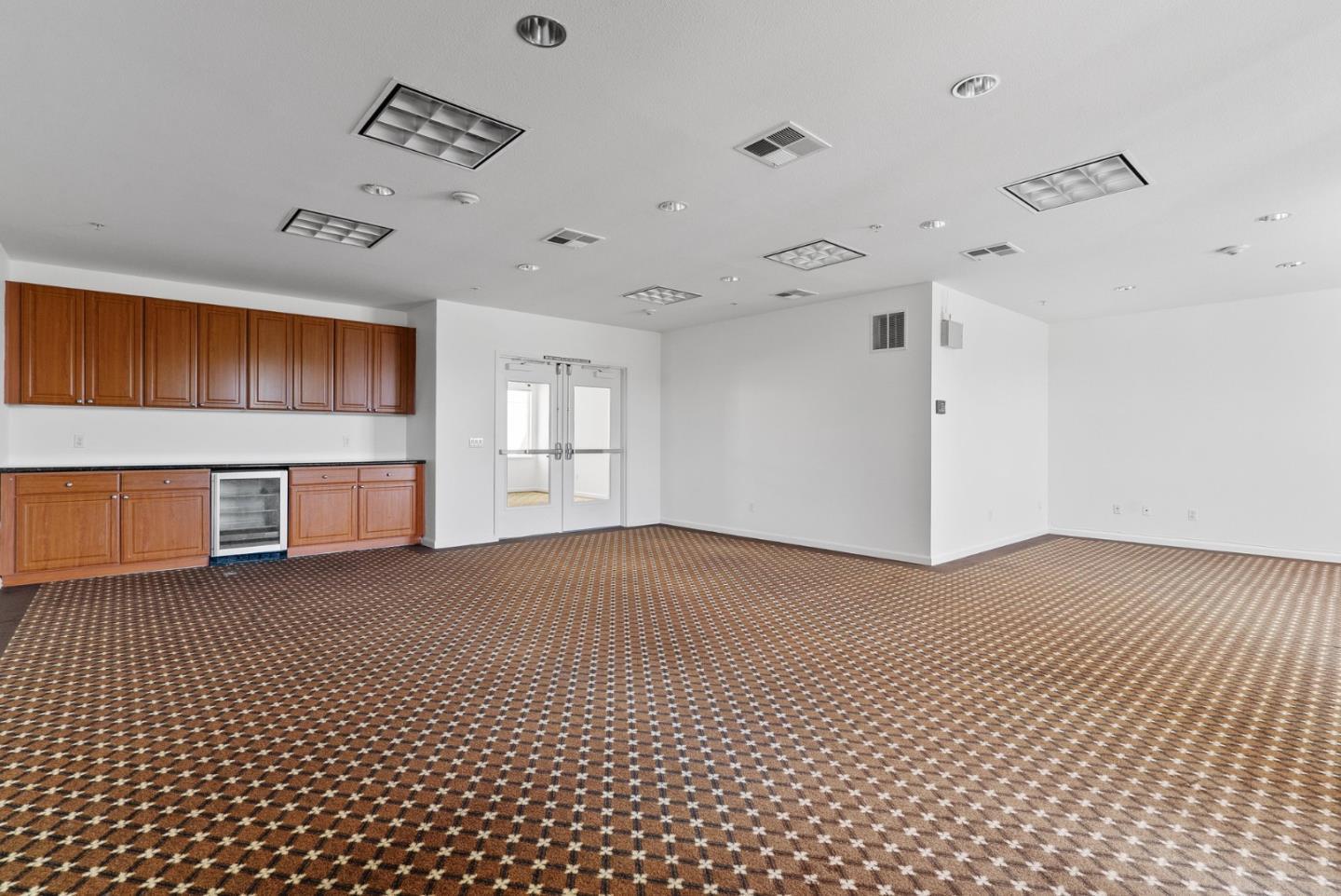 1883 Agnew Road, Unit 341 Santa Clara, CA 95054 - Photo 31 of 38 a view of an empty room with window and wooden floor