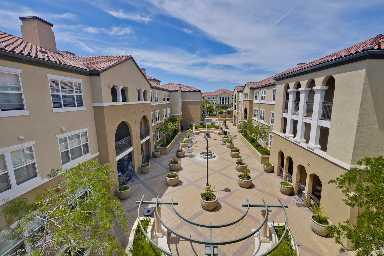 1883 Agnew Road, Unit 341 Santa Clara, CA 95054 - Photo 36 of 38 a view of a white house with swimming pool and sitting area