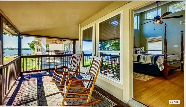 a view of a balcony with chairs