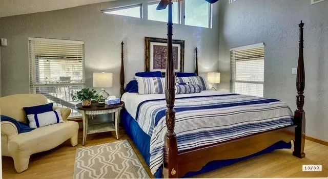 a bedroom with furniture and a window